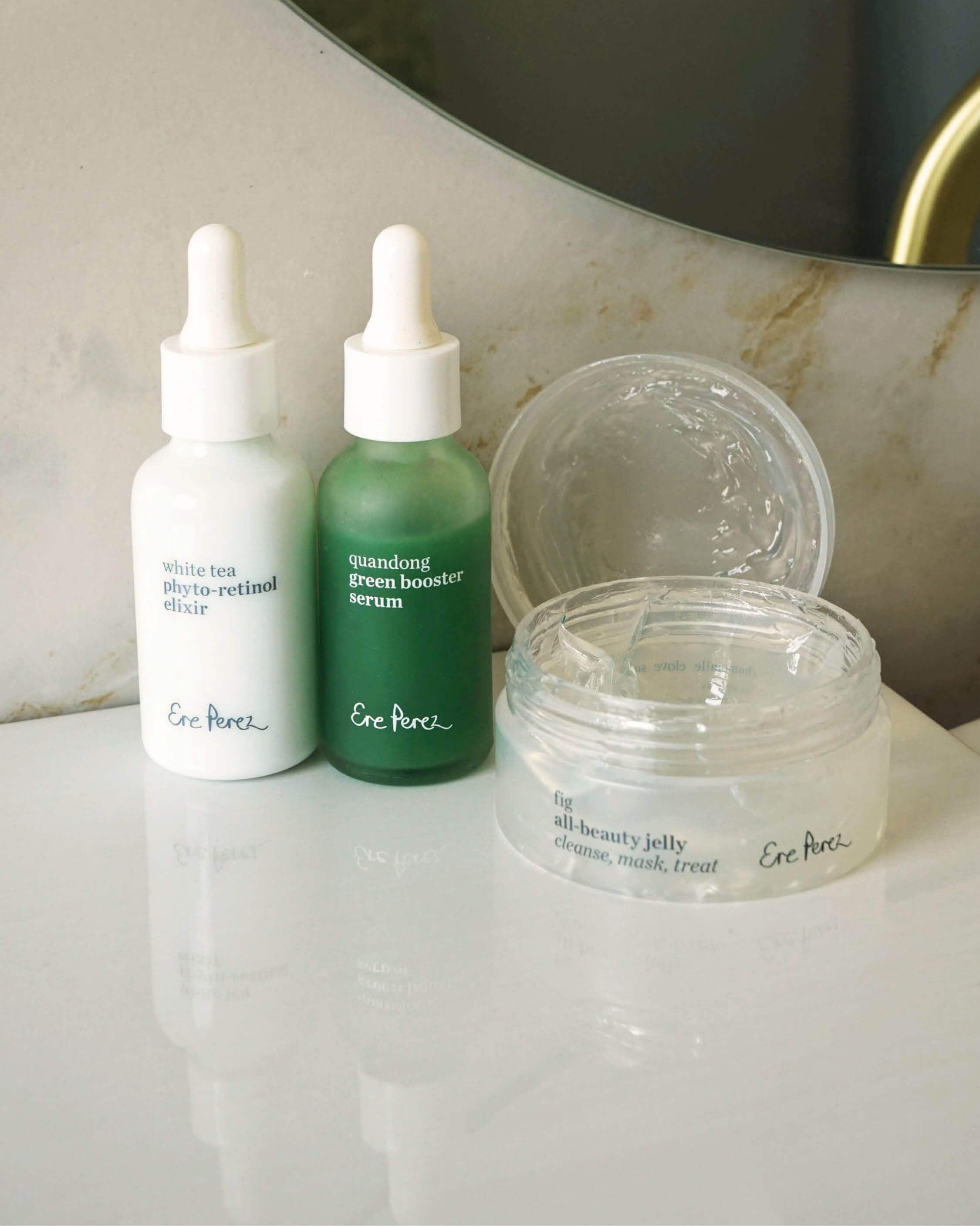 Clear skin set by Ere Perez, to clear acne naturally with a bottle of quandong green booster serum, a bottle of white tea photo-retinol elixir &amp; a pot of fig all-beauty jelly