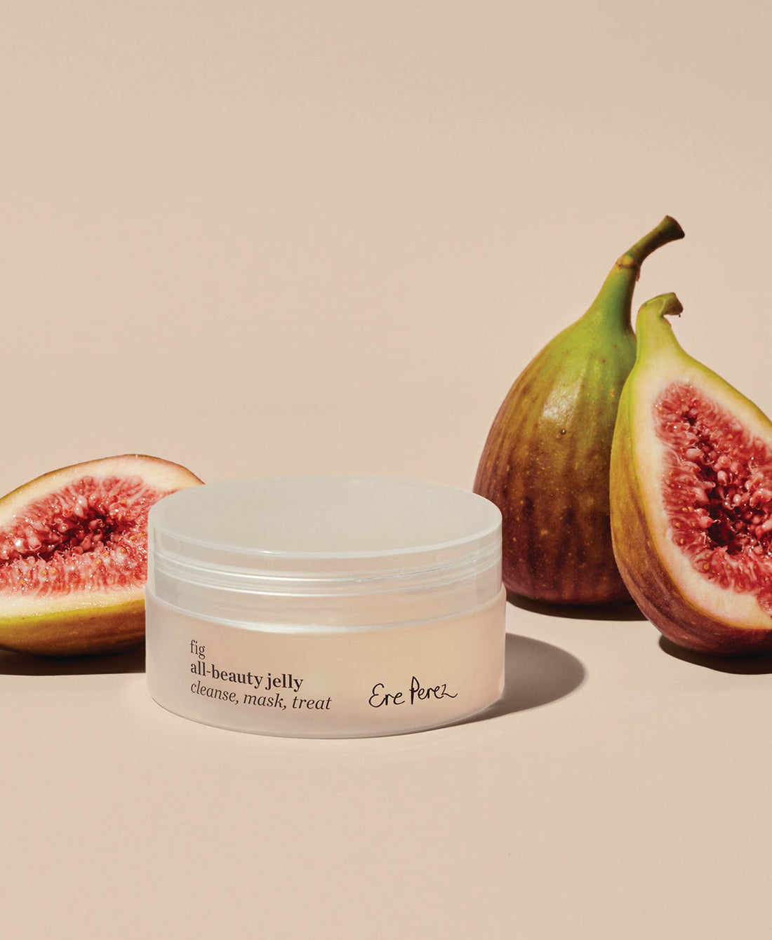natural fig all-beauty jelly by Ere Perez next to its star ingredient: figs